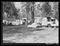 Construction workers drying out bedding and mattress from their trailer after a week of heavy rains. Alexandria, Louisiana. Sourced from the Library of Congress.