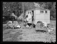 Construction workers drying out bedding and mattresses from their trailer after a week of heavy rains and winds. Near Camp Livingston, Alexandria, Louisiana. Sourced from the Library of Congress.