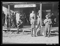 [Untitled photo, possibly related to: Spanish trappers and fur buyers waiting around while muskrats are being graded during auction sale on porch of community store. Saint Bernard, Louisiana]. Sourced from the Library of Congress.