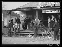 [Untitled photo, possibly related to: Spanish trappers and fur buyers waiting around while muskrats are being graded during auction sale on porch of community store. Saint Bernard, Louisiana]. Sourced from the Library of Congress.