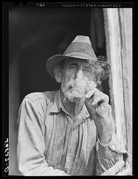 [Untitled photo, possibly related to: Spanish muskrat trapper in doorway of his marsh camp. Delacroix Island, Saint Bernard Parish, Louisiana]. Sourced from the Library of Congress.