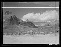 Burnt-over land, evidences of forest fire, rocky wall from Many Glacier highway. Glacier National Park, Montana. Sourced from the Library of Congress.