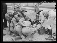 Boy scouts inspecting and learning about Army equipment in Commerce Square, Washington, D.C.. Sourced from the Library of Congress.