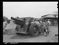 Boy scouts inspecting and learning about Army equipment in Commerce Square, Washington, D.C.. Sourced from the Library of Congress.