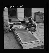 Metal reinforcing is placed over joints on inside face. Demonstration of home screen door construction. Saint Mary's County, Ridge, Maryland. Sourced from the Library of Congress.