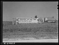 Sign in barnyard of farm along highway just south of Madison, Wisconsin. Sourced from the Library of Congress.