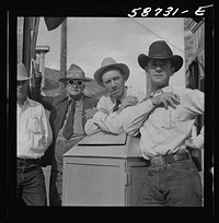 Stockmen on street corner. Sheridan, Wyoming. Sourced from the Library of Congress.