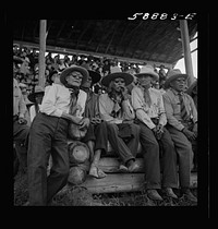 [Untitled photo, possibly related to: Indians watching Crow fair at Crow Agency, Montana]. Sourced from the Library of Congress.