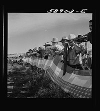 [Untitled photo, possibly related to: Indians watching the Crow fair at Crow Agency. Montana]. Sourced from the Library of Congress.