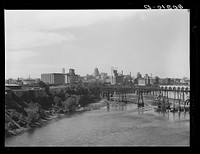 Flour mills and grain elevators along the river. Minneapolis, Minnesota. Sourced from the Library of Congress.