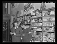 High school boy talking to druggist. Graceville, Minnesota. Sourced from the Library of Congress.