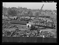 Loading scrap iron onto railroad cars. Minneapolis, Minnesota. Sourced from the Library of Congress.