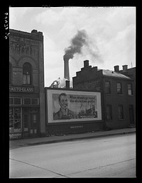 Dubuque's largest industry in background: sash and door company. Employs 1,500 men during peak. Dubuque, Iowa. Sourced from the Library of Congress.