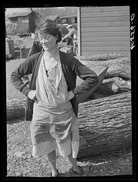 [Untitled photo, possibly related to: Woman who lives in shack town along Mississippi River bottoms. Dubuque, Iowa]. Sourced from the Library of Congress.