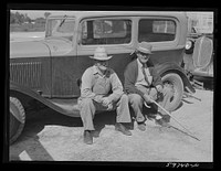 Men outside the Union Livestock Commission Company during an auction sale. Gering, Nebraska. Sourced from the Library of Congress.