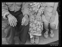 Hands of old couple and their granddaughter. Hilly Ozark farm country. Missouri. Sourced from the Library of Congress.
