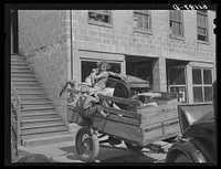 Trailer loaded with furniture of family about to move on in search of work picking fruit. Berrien County, Michigan. Sourced from the Library of Congress.