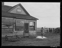 Mrs. Sauer waving goodbye to children who are going to school. Cavalier County, North Dakota. Sourced from the Library of Congress.