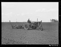 Four-row tractor corn planter. Jasper County, Iowa. Sourced from the Library of Congress.
