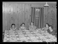 Members of the women's club making quilt. Granger Homesteads, Iowa. Sourced from the Library of Congress.