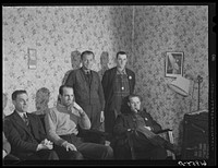Five of the boarders at Mrs. Pritchard's house in the parlor. Eighteen men board here. Radford, Virginia. Sourced from the Library of Congress.
