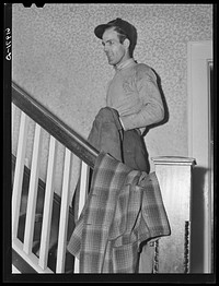 [Untitled photo, possibly related to: Powder plant employee going upstairs. Mrs. Pritchard's boardinghouse. Radford, Virginia]. Sourced from the Library of Congress.