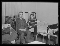 Father and son from Bluefield, West Virginia Both employed at powder plant. Radford, Virginia. In boardinghouse room which they share with four others. Sourced from the Library of Congress.