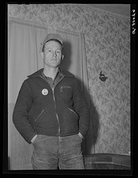 Paul McDaniel with his laborer's button. Each employee wears an identification. Sourced from the Library of Congress.