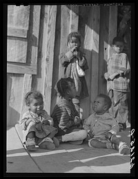 [Untitled photo, possibly related to: Front porch of sharecropper home. Etowah County, Alabama]. Sourced from the Library of Congress.