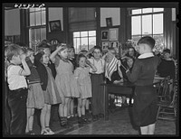 Reciting "I pledge allegiance," etc., public school. Norfolk, Virginia. Sourced from the Library of Congress.