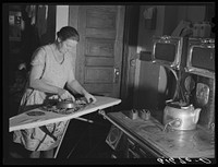 Mrs. Bettenhausen ironing. McIntosh County, North Dakota. Sourced from the Library of Congress.