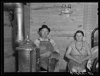[Untitled photo, possibly related to: Agricultural day laborer, wife and daughter in new home built by FSA (Farm Security Administration). New Madrid County, Missouri]. Sourced from the Library of Congress.