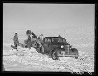 Pulling government car out of snowdrift. Todd County, South Dakota. Sourced from the Library of Congress.