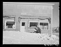 Shoveling snow in front of post office. Mission, South Dakota. Sourced from the Library of Congress.