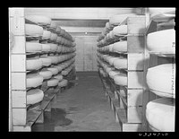[Untitled photo, possibly related to: Cheese in storage. Swiss cheese factory. Madison, Wisconsin]. Sourced from the Library of Congress.