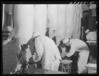 Government inspection of hog carcasses. Packing plant, Austin, Minnesota. Sourced from the Library of Congress.