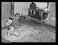 Child of defense worker from North Carolina who lives with family (wife and three children) in one room apartment in Helping Hand Mission. Portsmouth, Virginia. Sourced from the Library of Congress.