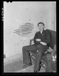 Boy from North Carolina farm who now works at National Tent and Awning Company. Norfolk, Virginia. Sourced from the Library of Congress.