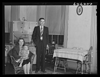 Defense worker and family. They are from North Carolina, at present living in one-room apartment in Helping Hand Mission. Portsmouth, Virgninia. Sourced from the Library of Congress.