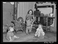 Family of defense worker from North Carolina. They live in one-room apartment in Helping Hand Mission. Portsmouth, Virginia. Sourced from the Library of Congress.