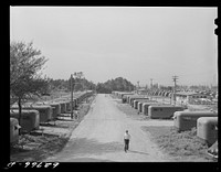 [Untitled photo, possibly related to: "Trailer service unit" of water faucet and garbage pail is provided for every ten trailers at FSA (Farm Security Administration) camp. Erie, Pennsylvania]. Sourced from the Library of Congress.