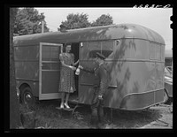 Milk delivery at trailer in FSA (Farm Security Administration) camp for defense workers. Erie, Pennsylvania. Sourced from the Library of Congress.