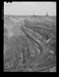 One end of the largest open pit iron mine in the world. The Hull-Rust-Mahoning, Hibbing, Minnesota. Sourced from the Library of Congress.