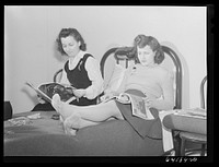 These girls work at the Aberdeen proving grounds and live in dormitory built by FSA (Farm Security Administration) for defense workers. Aberdeen, Maryland. Sourced from the Library of Congress.