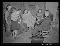 [Untitled photo, possibly related to: Scott County, Missouri. Country doctor visiting farm family]. Sourced from the Library of Congress.