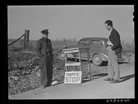 [Untitled photo, possibly related to: Newton County, Missouri. Camp Crowder area. Walter Manz, farmer whose land was bought up by the Army for construction at Camp Crowder, has moved to town and has a job as project guard. Farmers from the area bought by the Army were given preference in employment] by John Vachon