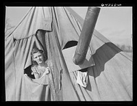 [Untitled photo, possibly related to: Newton County, Missouri. Camp Crowder area. Wife of construction worker from Oklahoma living in tent along U.S. Highway No. 71]. Sourced from the Library of Congress.