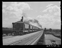 Cars of ore from the Minnesota iron range going onto loading docks at Allouez, Wisconsin. Sourced from the Library of Congress.