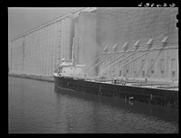 Loading grain boats at Great Northern elevator. Superior, Wisconsin. Sourced from the Library of Congress.