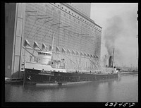 Loading grain boat at Great Northern elevator. Superior, Wisconsin. Sourced from the Library of Congress.